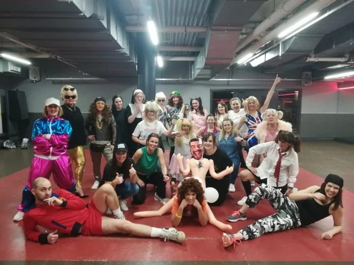 90s hen party dance class in Nottingham, group mid-routine in throwback gear
