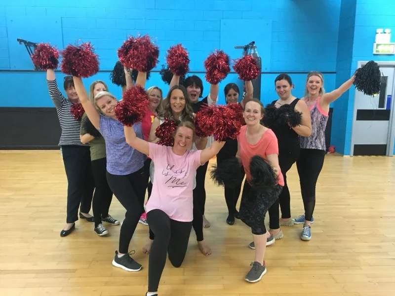 Cheerleading hen party dance class Nottingham group with pom-poms