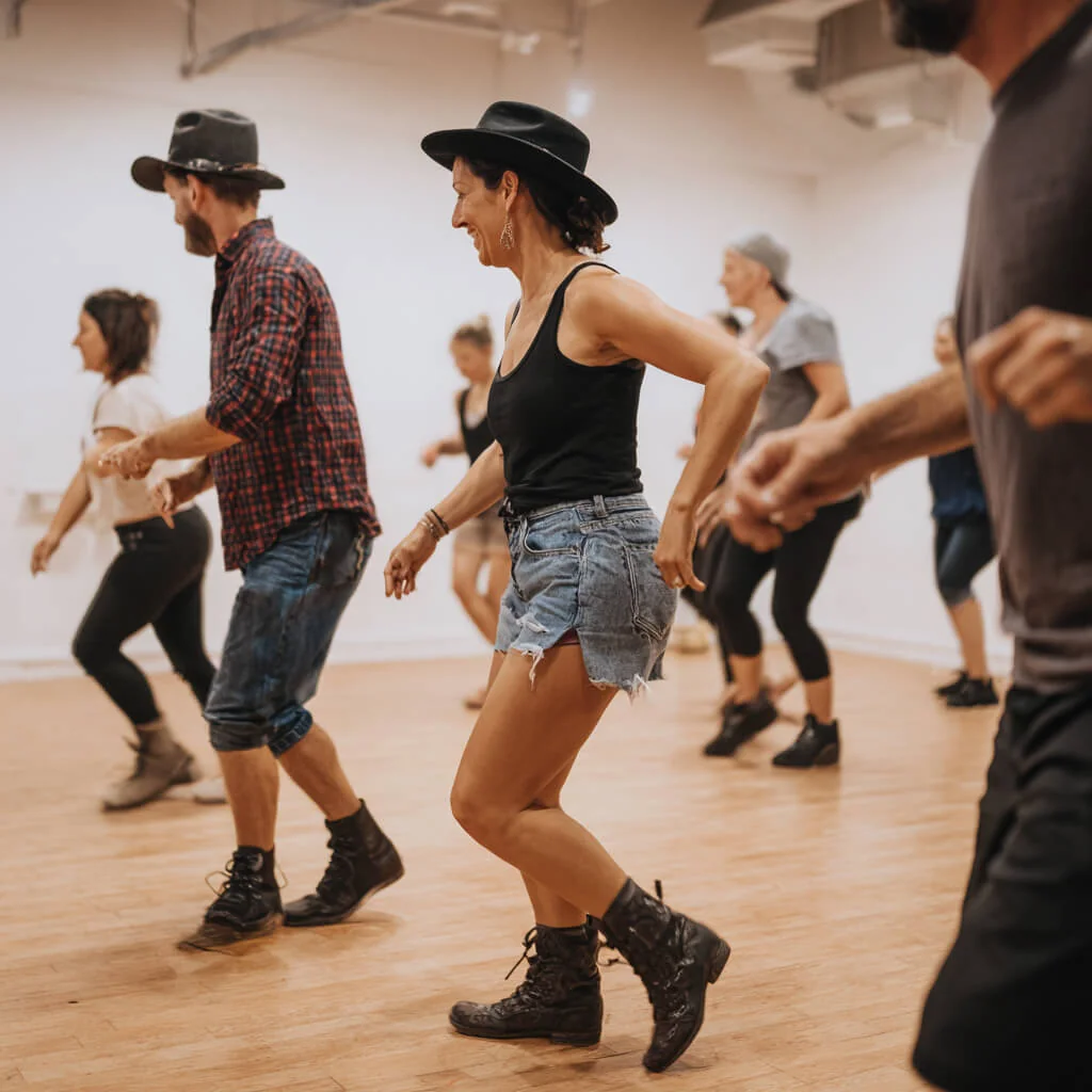 Adults line dancing in rows at a weekly class in Nottingham