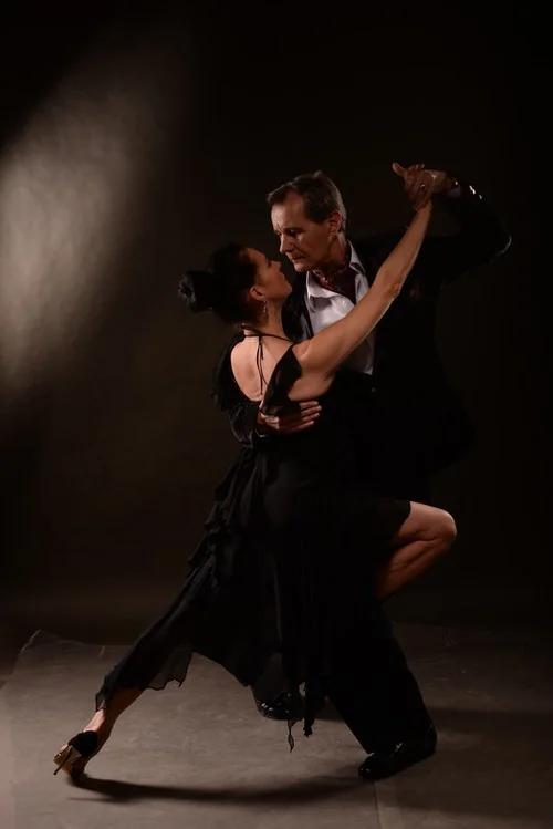 Adults learning Argentine tango at a weekly dance class in Nottingham